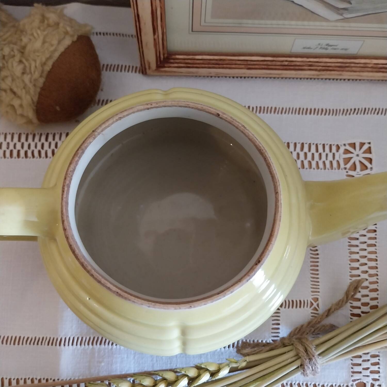 Old yellow earthenware teapot