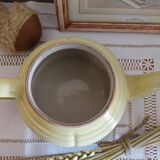 Old yellow earthenware teapot
