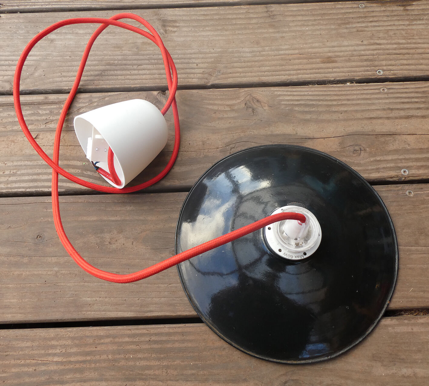 Black hanging lamp in enamelled sheet metal