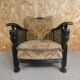 Old armchair upholstered in velvet, carved and caned wood