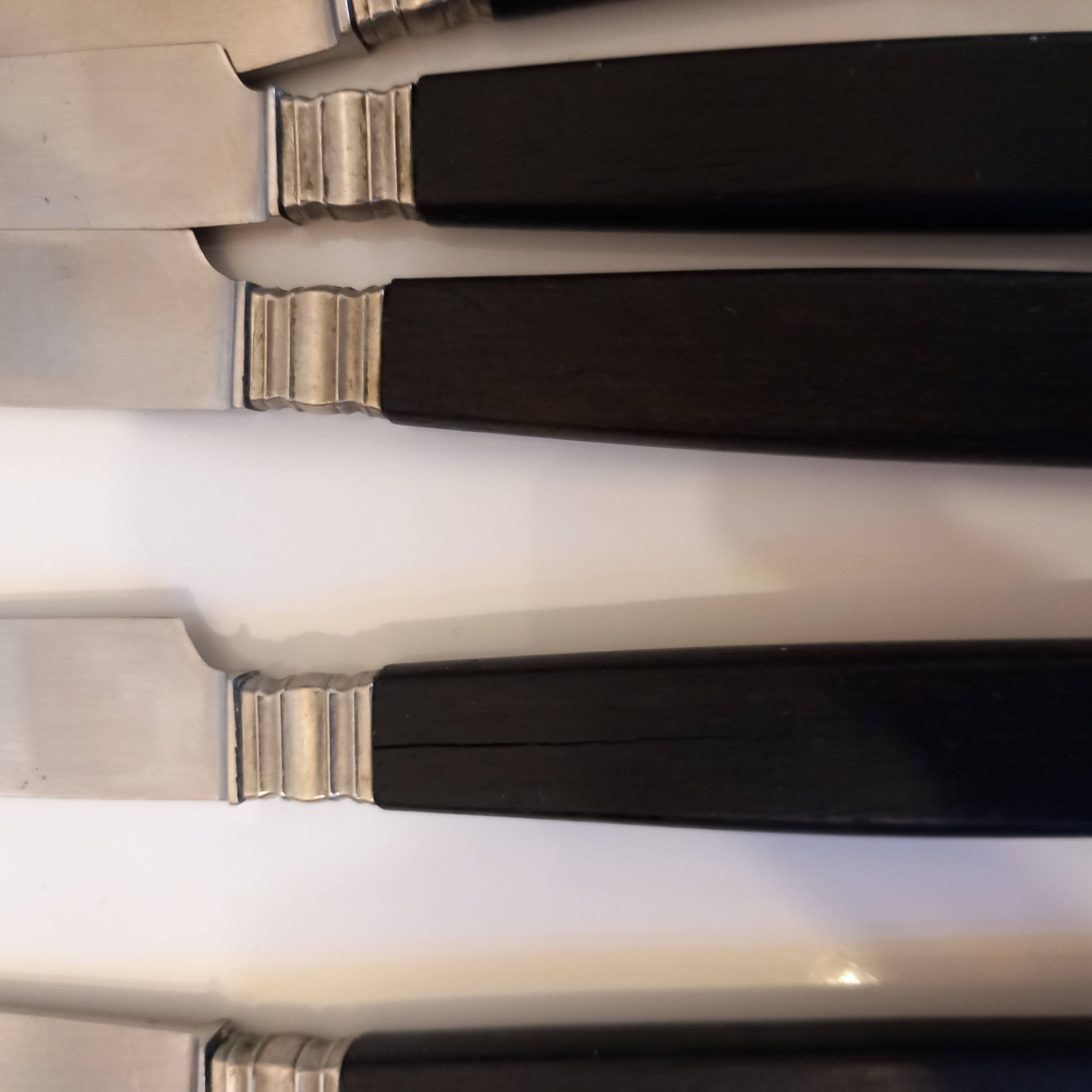 12 black Empire style table knives with silver ferrule Gimel