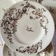 4 assiettes plates en terre de fer marron à décor d'oiseaux