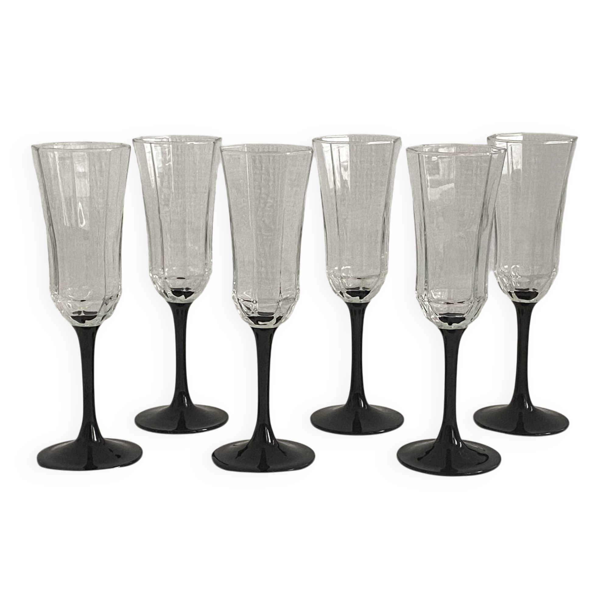 Set of 6 Octime champagne flutes in glass with black stem.