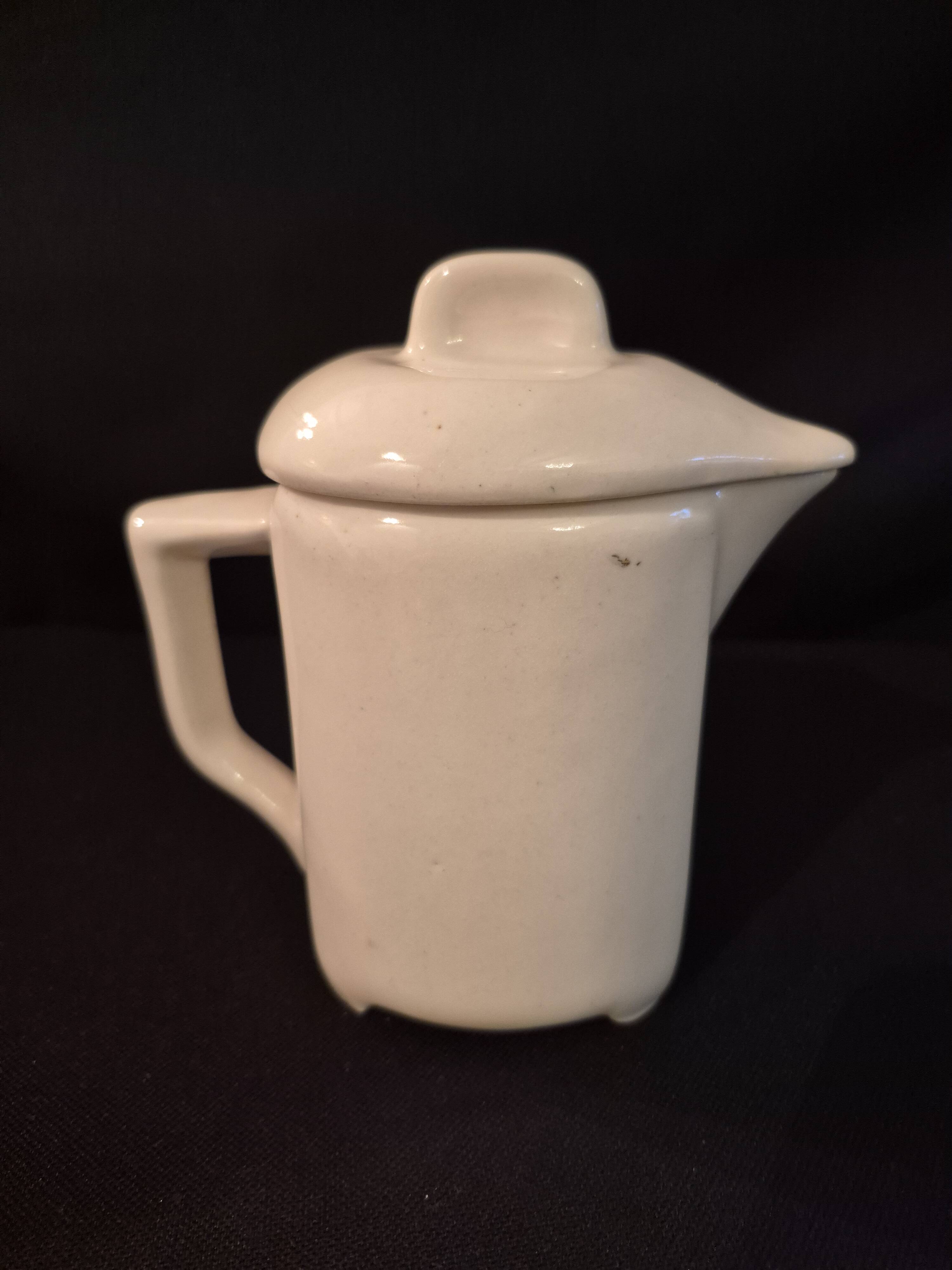 Vintage vase, geometric frieze and flowers with a black border.