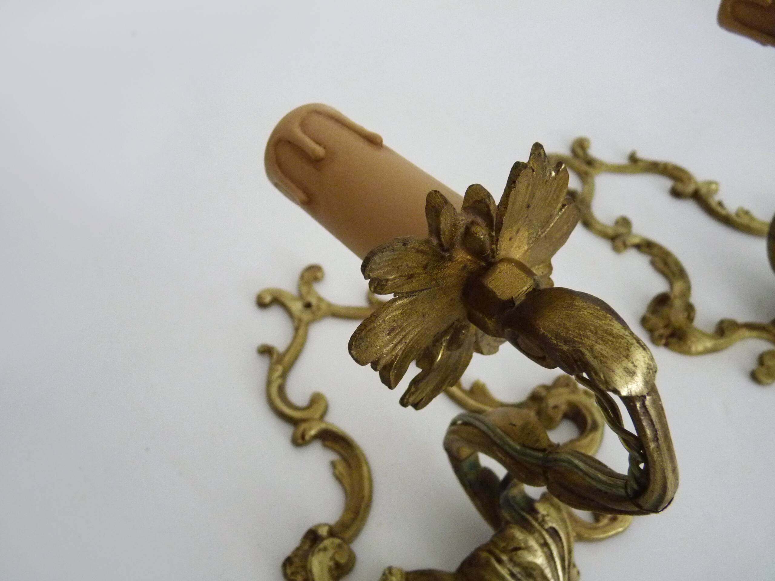 Vintage pair of bronze wall sconces from the 1950s and 60s.