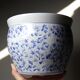 Vintage Chinese cache-pot in blue and white porcelain with a floral design.