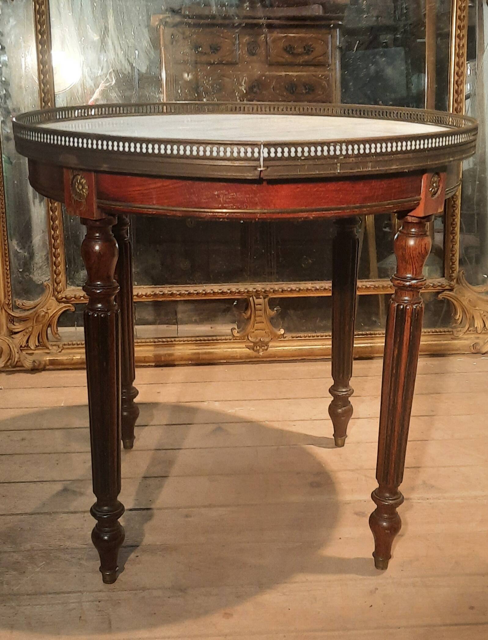 Coffee table with a marble top, known as "bouillotte".