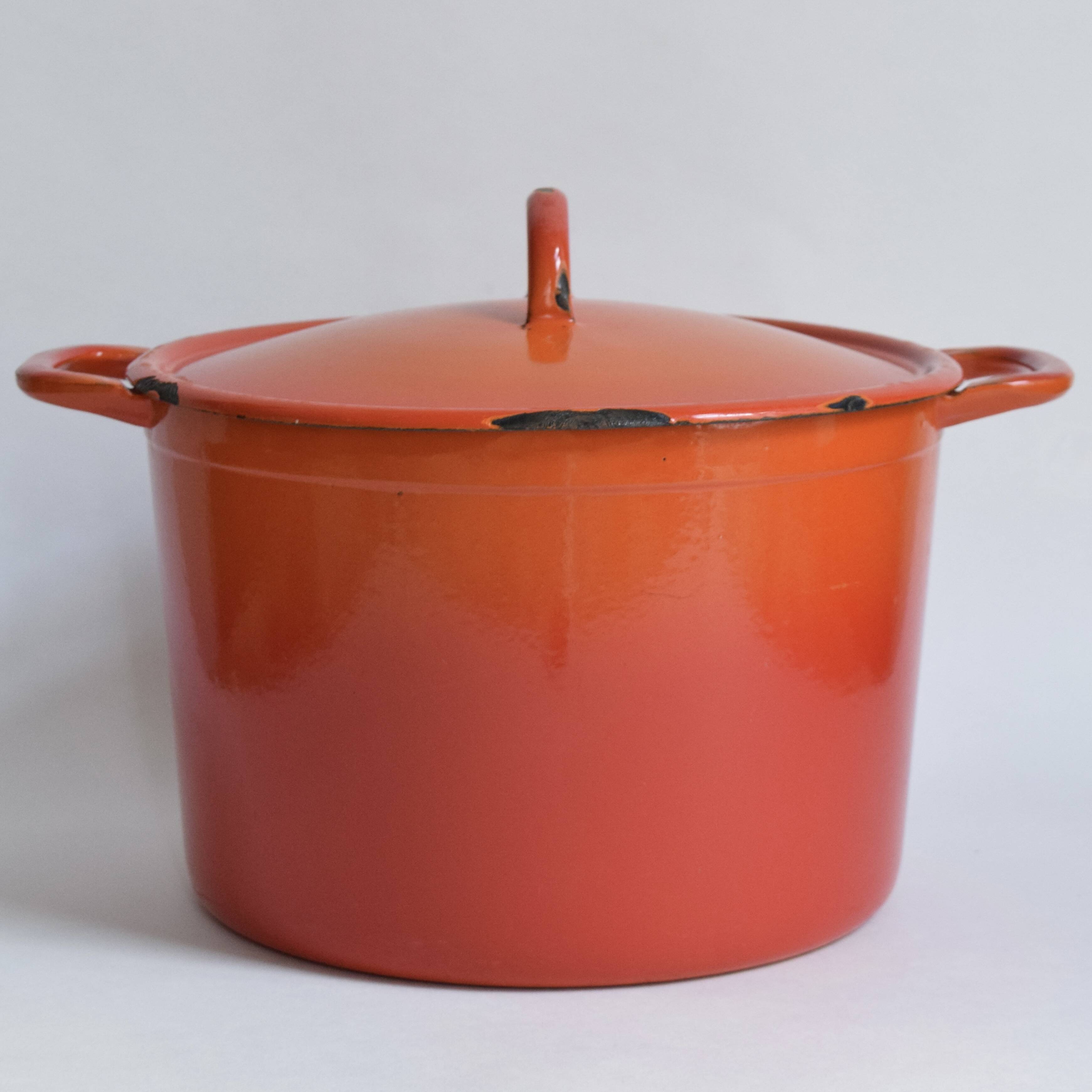 Large vintage saucepan or casserole dish in orange enameled cast iron