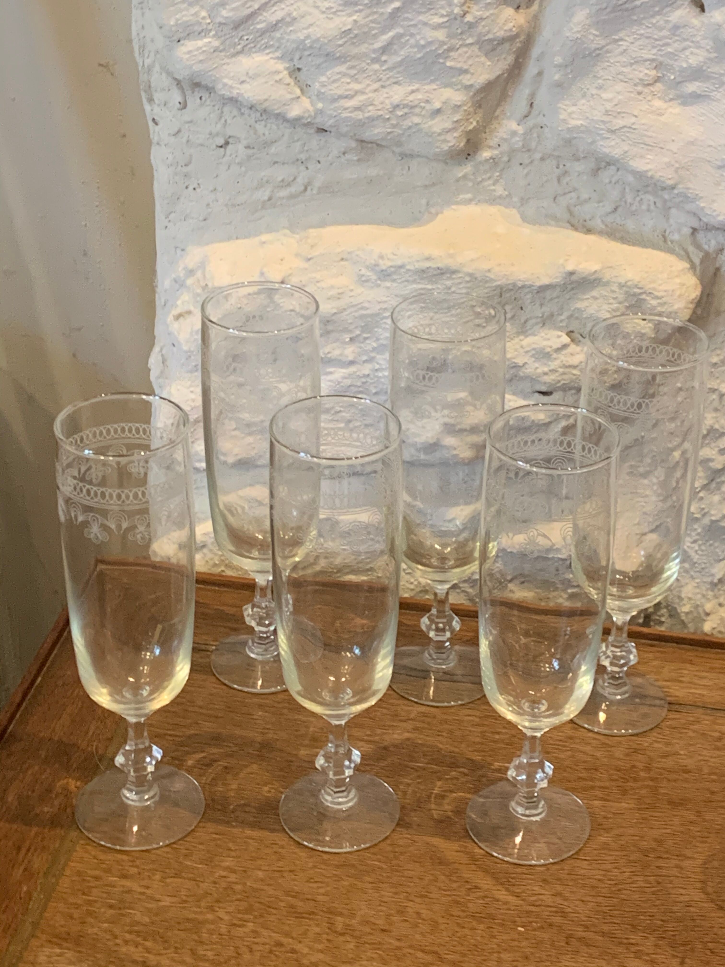 6 chiseled champagne flutes on vintage floral frieze pattern