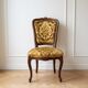 Antique Baroque-style armchair in wood and golden velvet