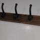 Vintage wooden coat rack with 5 double cast iron hooks