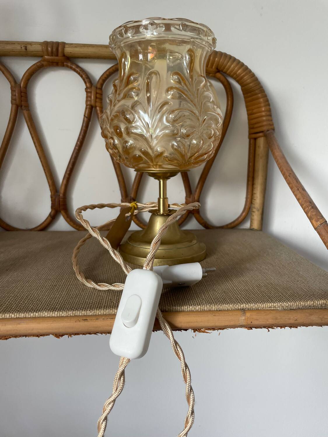 Table lamp with amber glass globe and brass base