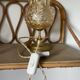 Table lamp with amber glass globe and brass base