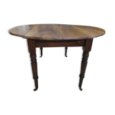 Table ronde 4 pieds, ouvrante à volets en noyer