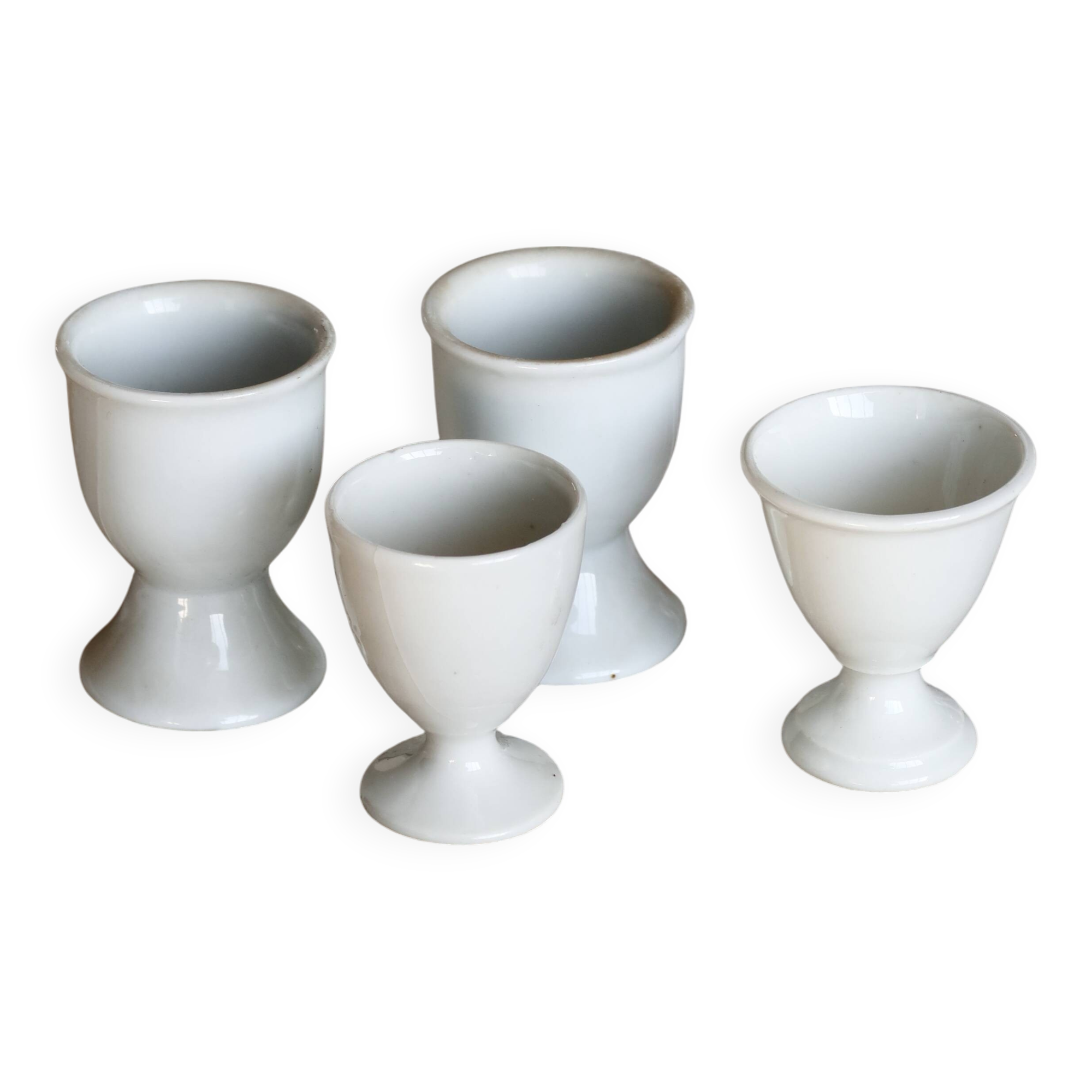 4 mismatched vintage white porcelain egg cups