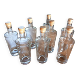 Set of 8 glass bottles with corks