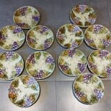 Set of 12 antique earthenware plates in slip with grapes and vines