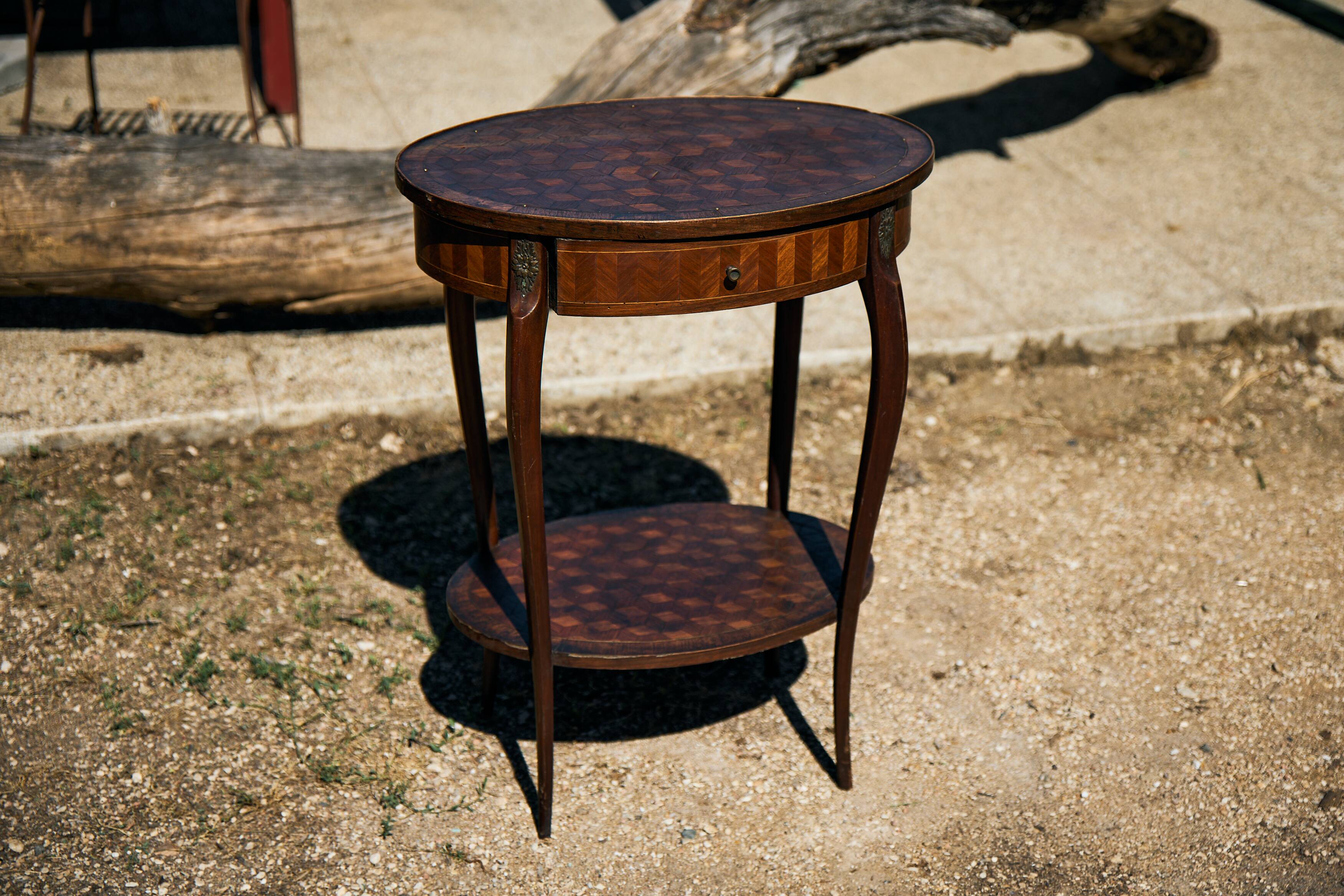 Oval coffee table in cube marquetry and bronze, Louis XV style.