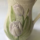 Barbotine pitcher with embossed tulip decoration and spike