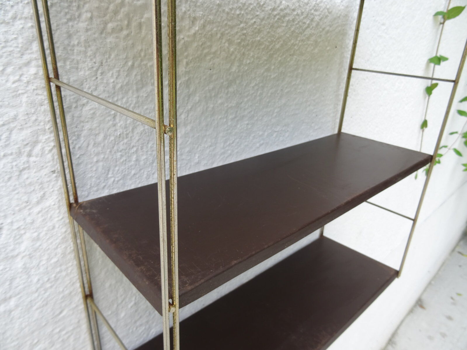 Metal string modular wall shelf