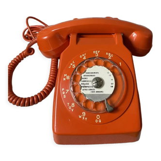 Orange phone with dial