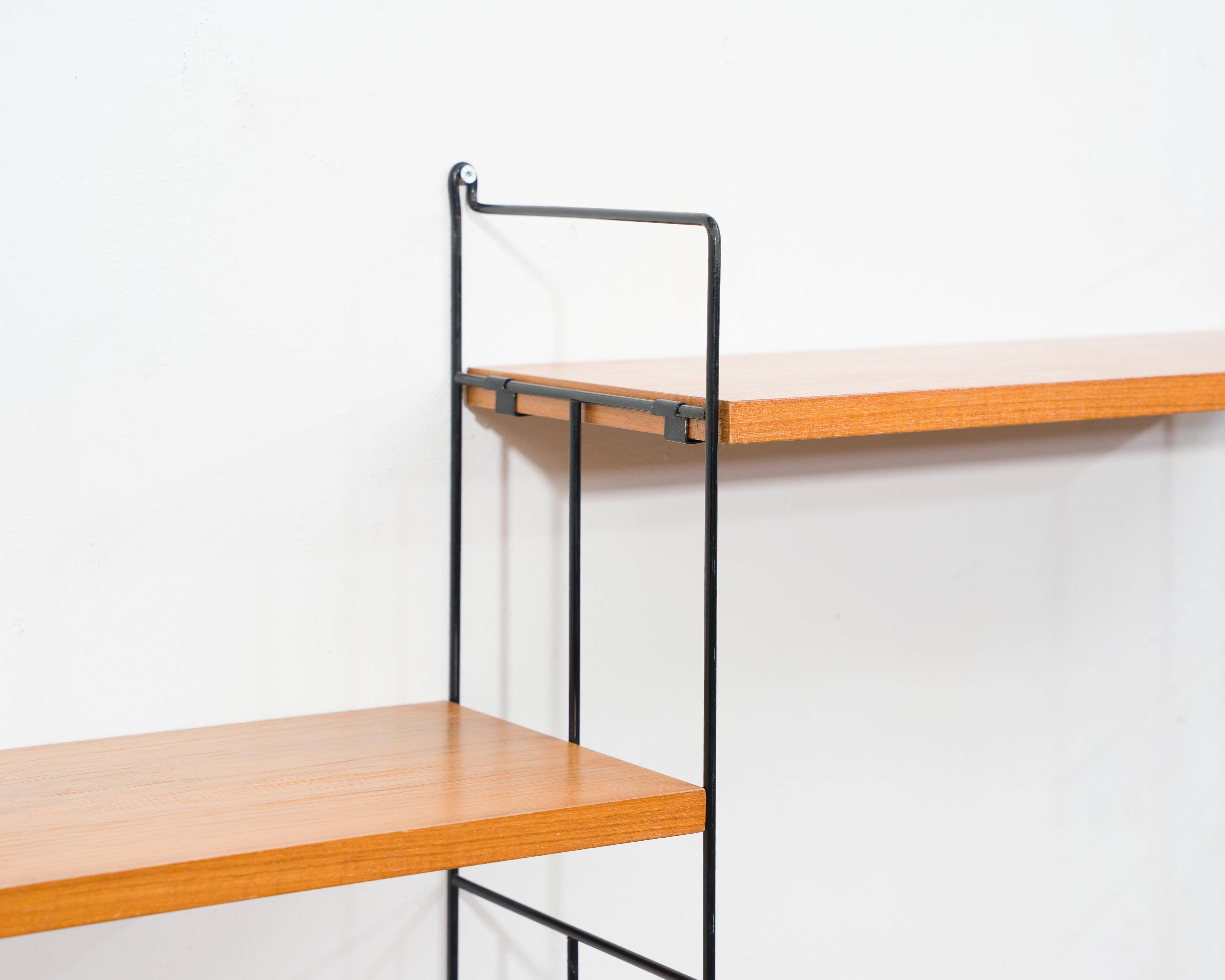 1960s teak wall shelf, manufacturer WHB, eight shelves