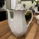 Vintage coffee pot in white porcelain with a gold trim.