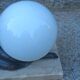Art Deco lamp in cast iron and marble with a white opaline globe.