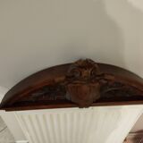 old pediment in carved walnut