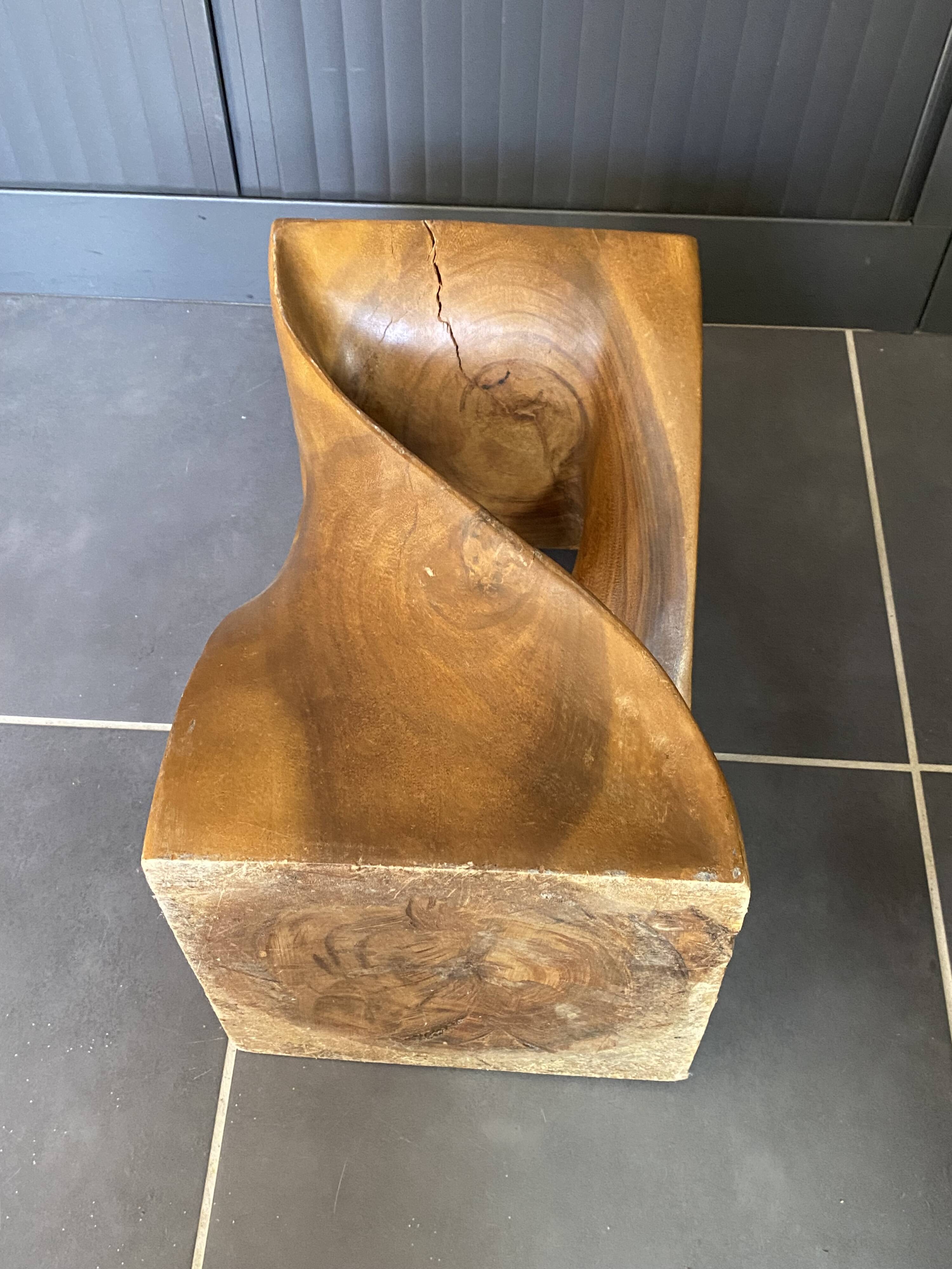 Stool n2 in solid raw walnut wood carved from the mass 1970