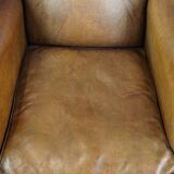 Sheep leather wingback chair with patina
