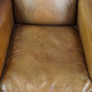 Patinated sheep leather wingback armchair