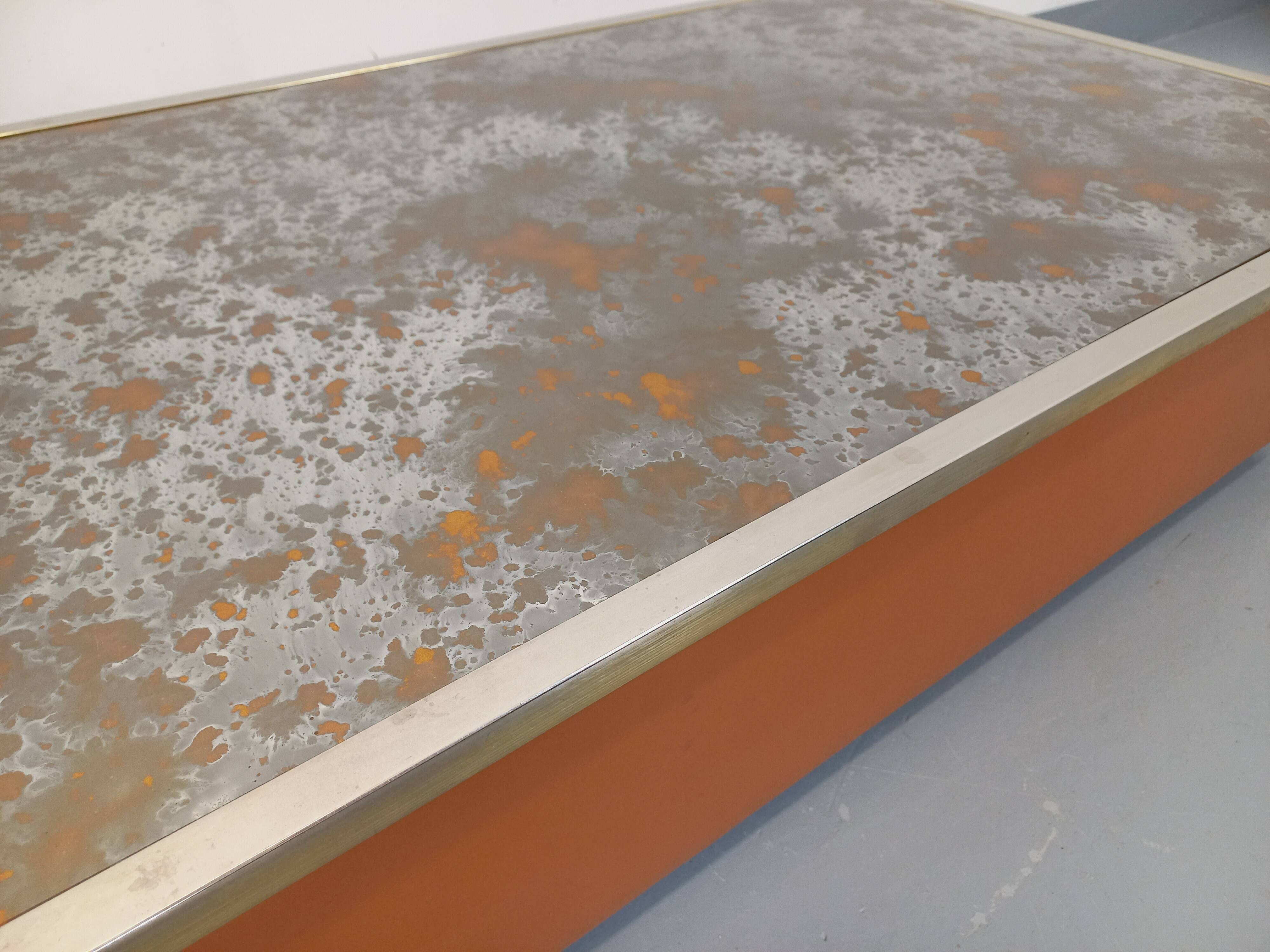 Vintage coffee table in églomisé glass, chrome and leather from the 70s