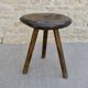 Tripod stool made of carved solid wood, handcrafted, around 1950.