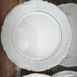 12 flat plates in porcelain with double gold rim.