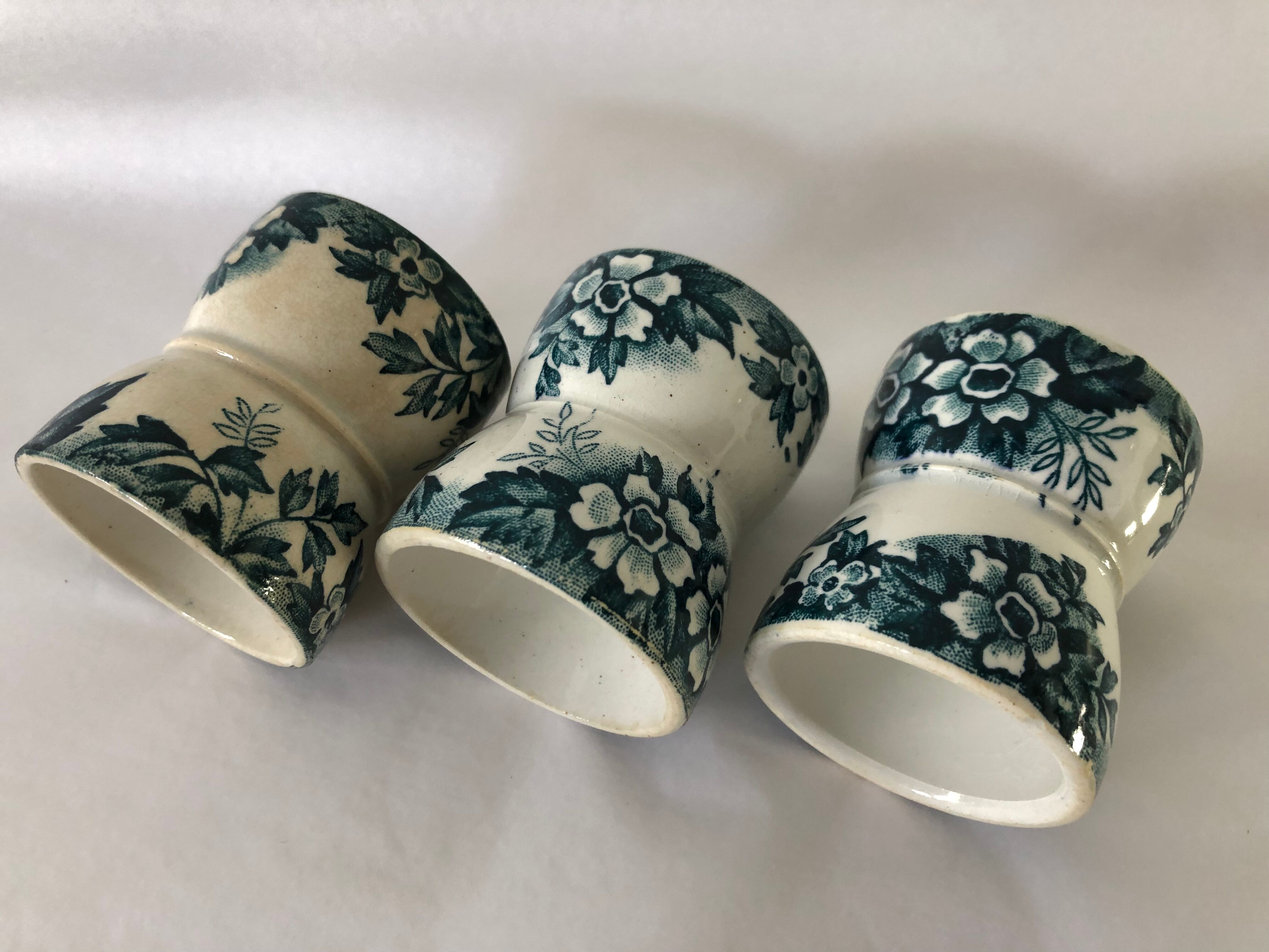 Trio of former egg cups earthenware