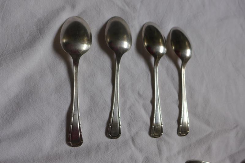 10 small silver spoons