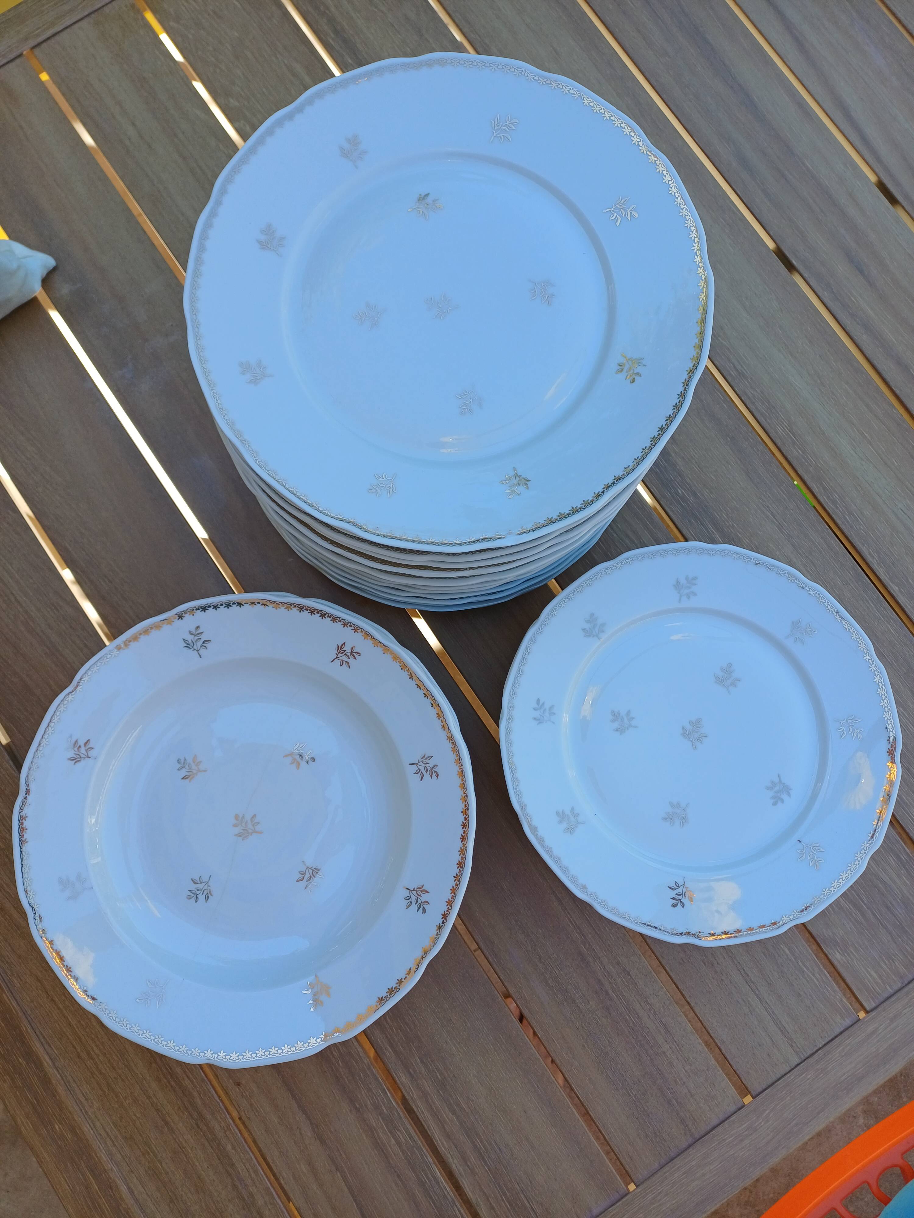 A lot of old white and gold porcelain plates T de F.