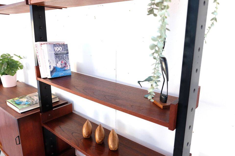 Vintage teak shelving system in 60s-70s style, retro style.
