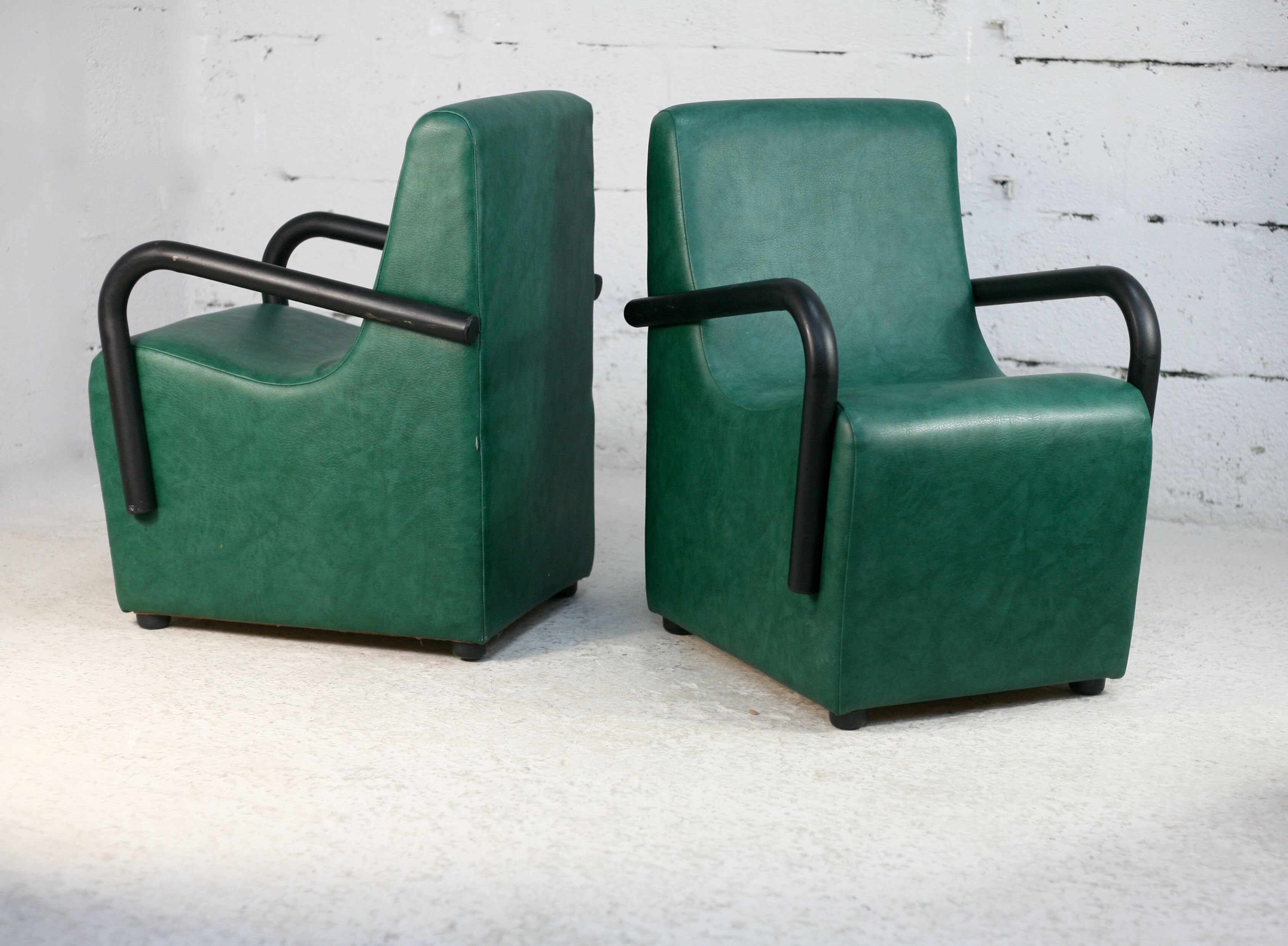Pair of armrest heaters. Steel and green imitation leather. France, circa 1980