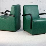 Pair of armrest heaters. Steel and green imitation leather. France, circa 1980