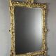 Large gilded wooden mirror in Louis XV style, 19th century.