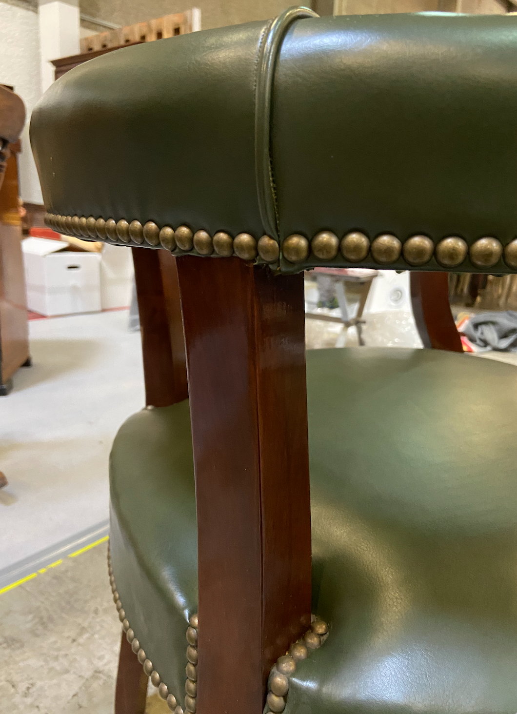 Empire style office armchair in green leather
