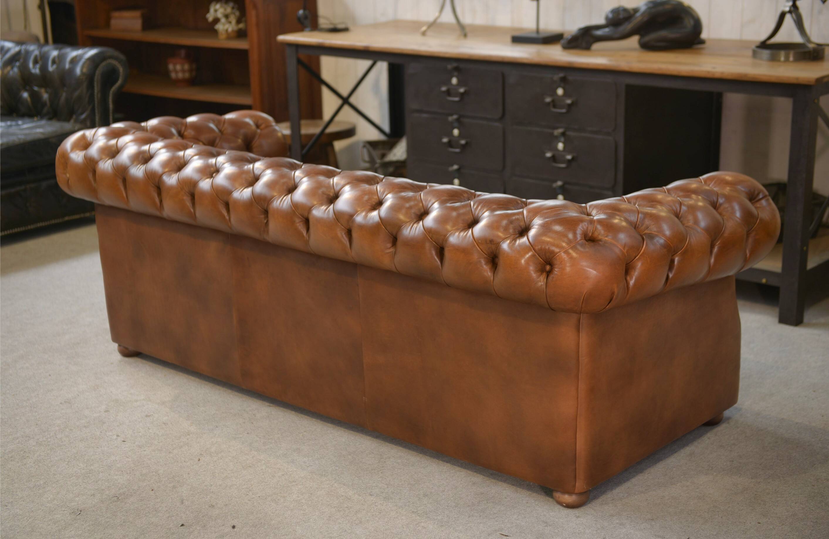 Tan leather tufted Chesterfield sofa