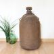 Big demijohn with burlap