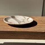 Tray, circular dish or plate made of white striped grey petrified wood.