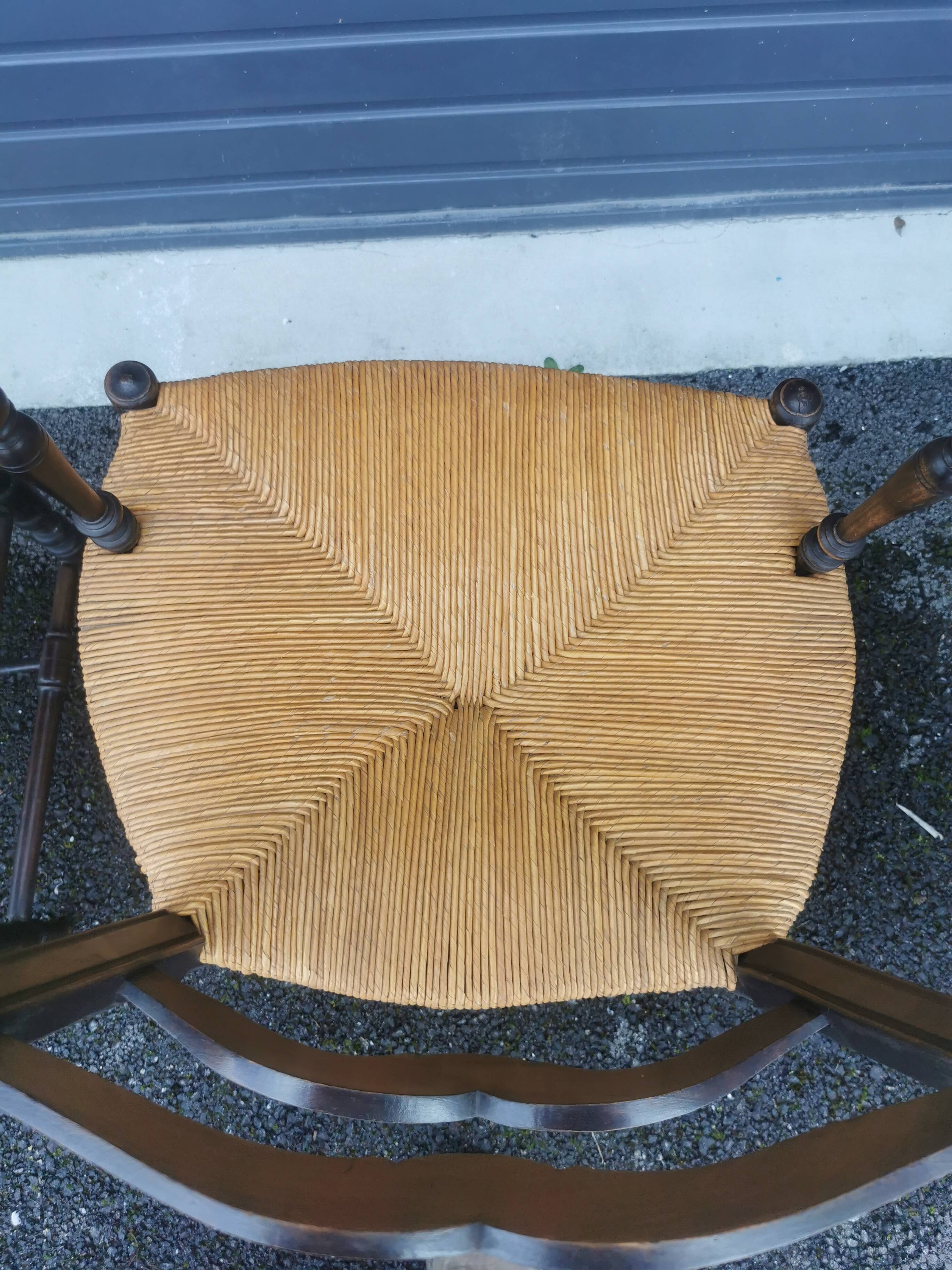 Pair of blackened wooden armchairs