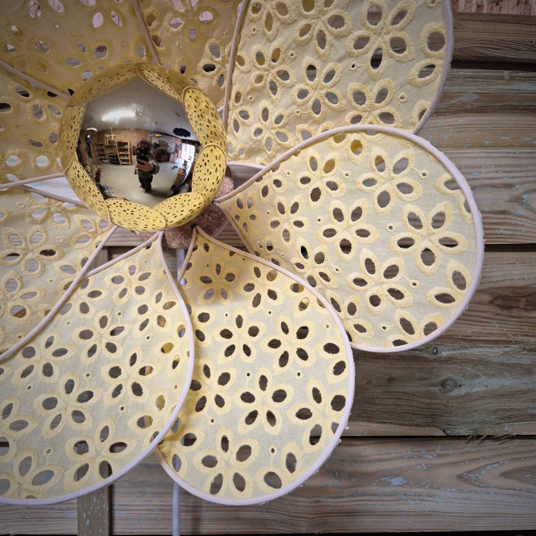Wall sconce with flower, rattan petals and pastel yellow eyelet embroidery