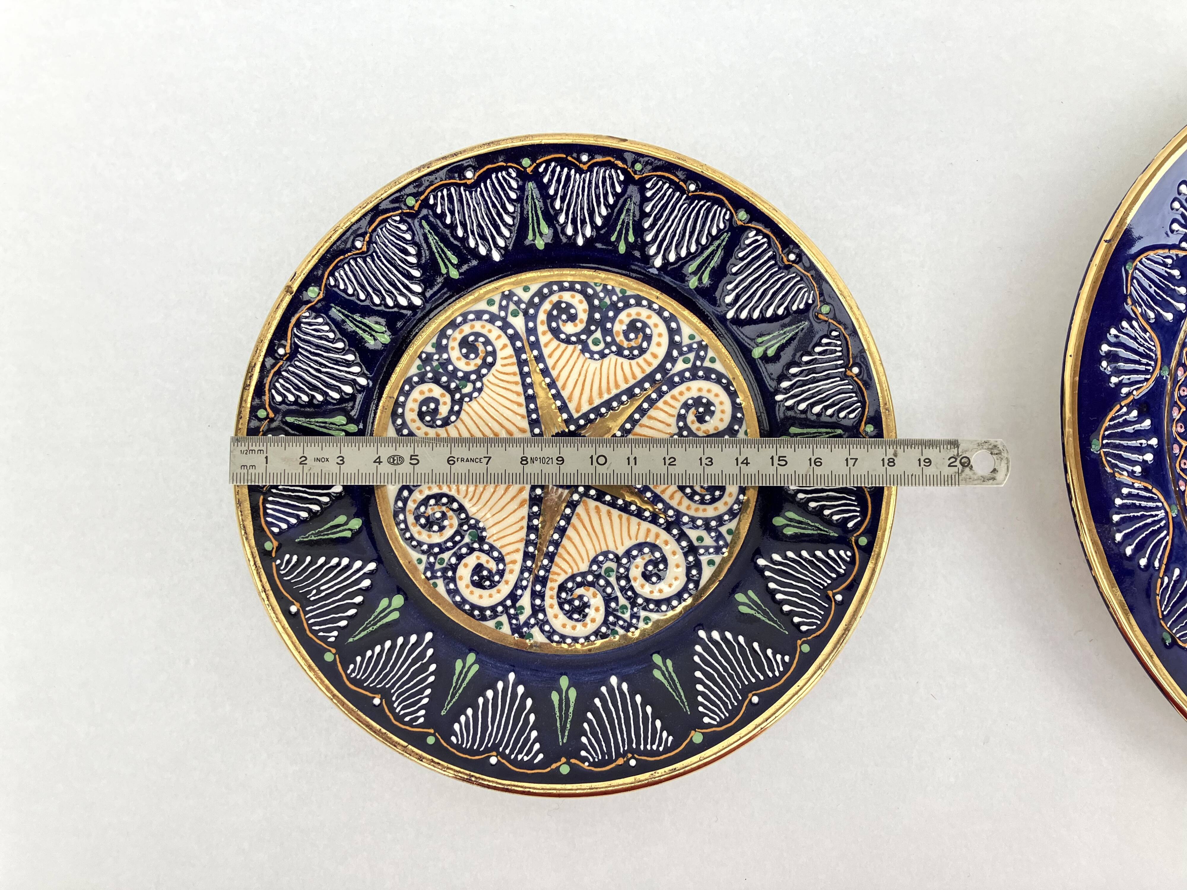 2 enamelled earthenware plates signed HB Quimper • Embroidery or beaded decoration by Pierre Poquet in relief