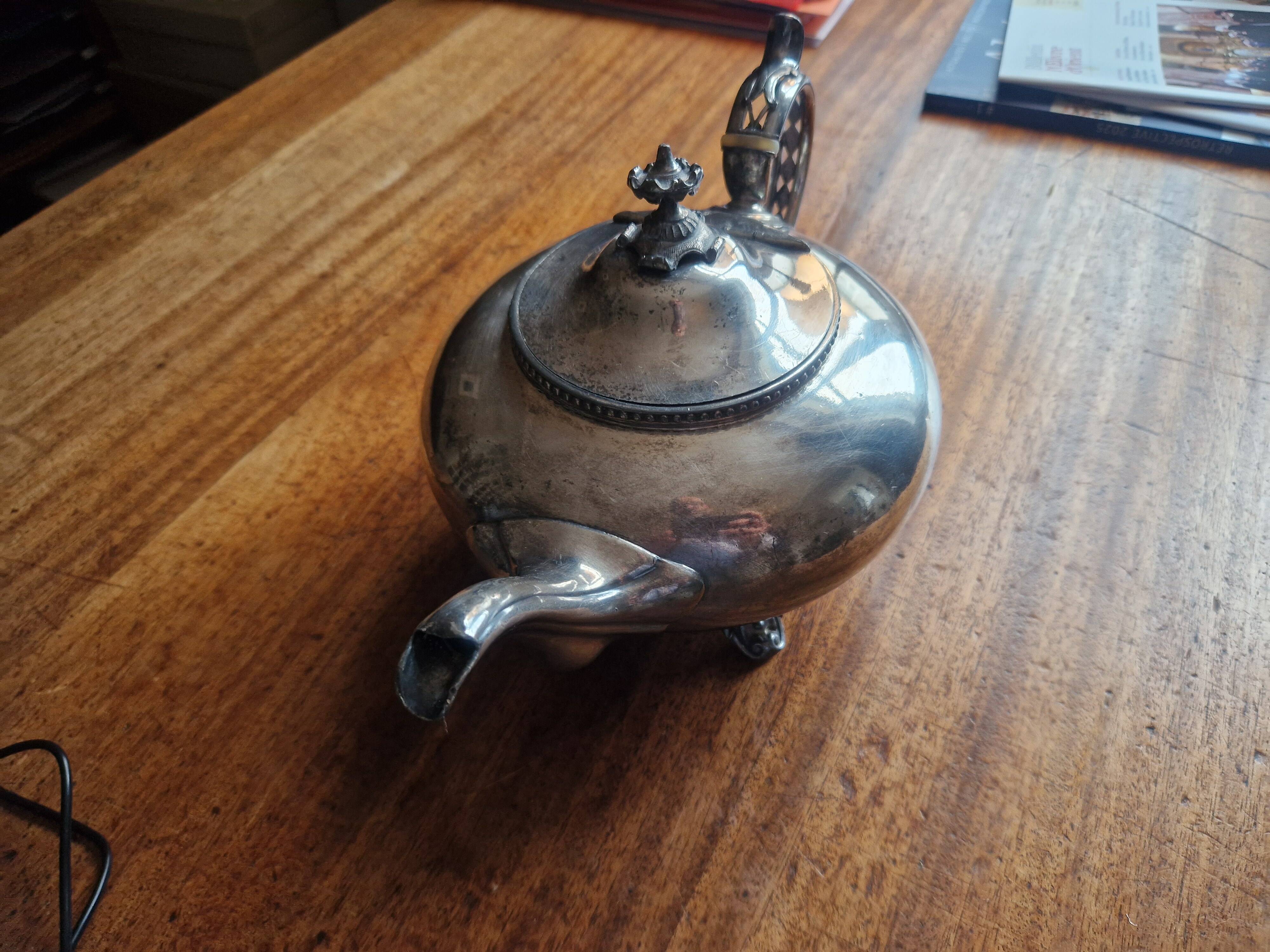 Silver-plated metal teapot in English style